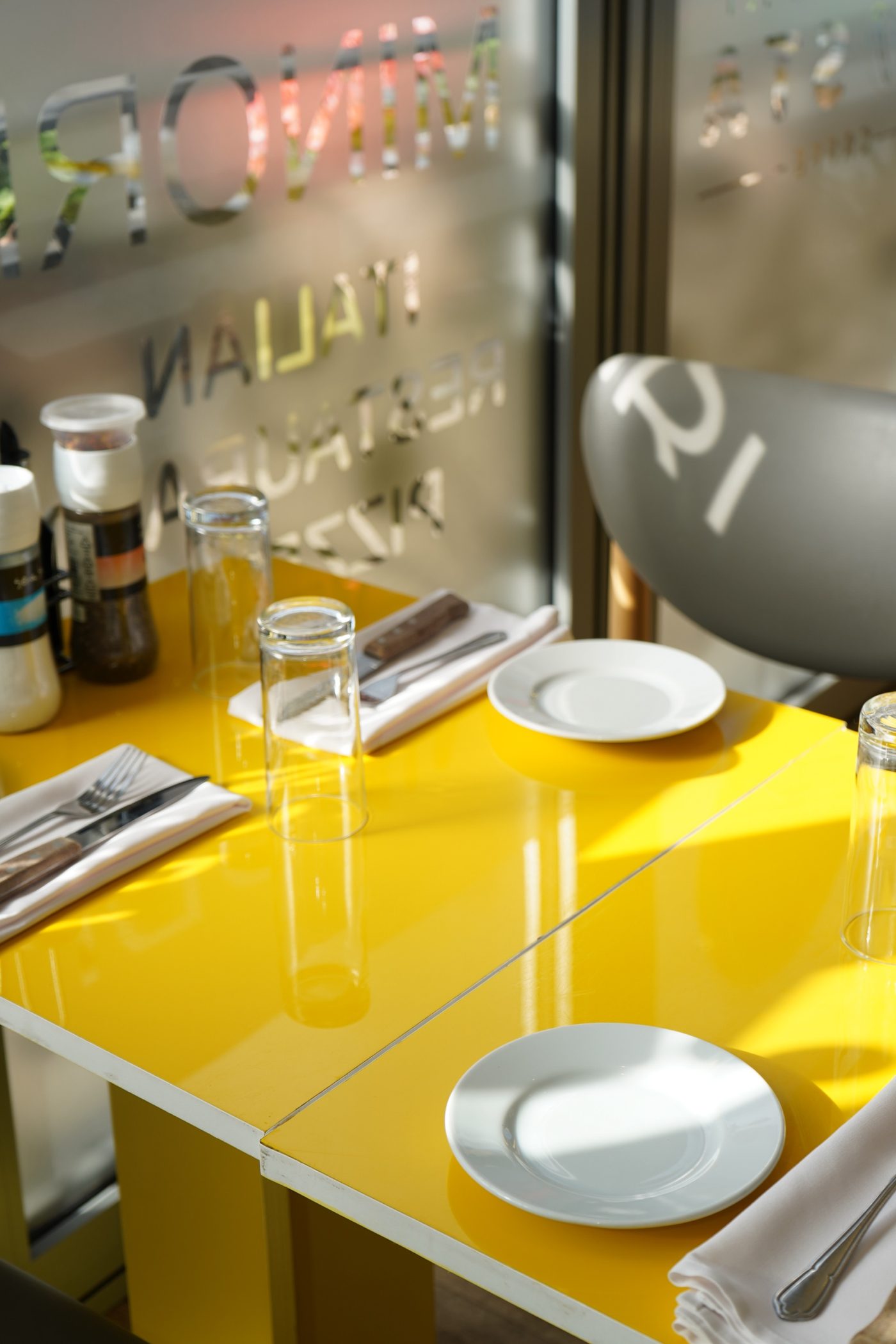 A table laid in the sun by the Minori window